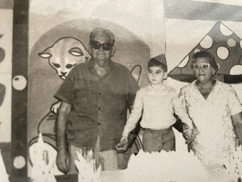 Childhood photo of me with my grandfather and grandmother in Cuba celebrating my birthday